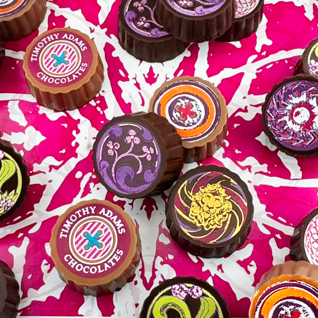 Timothy Adams Ultimate Collection luxury chocolate truffles in couture-inspired box, handcrafted with Valrhona chocolate — bestselling gourmet gift.