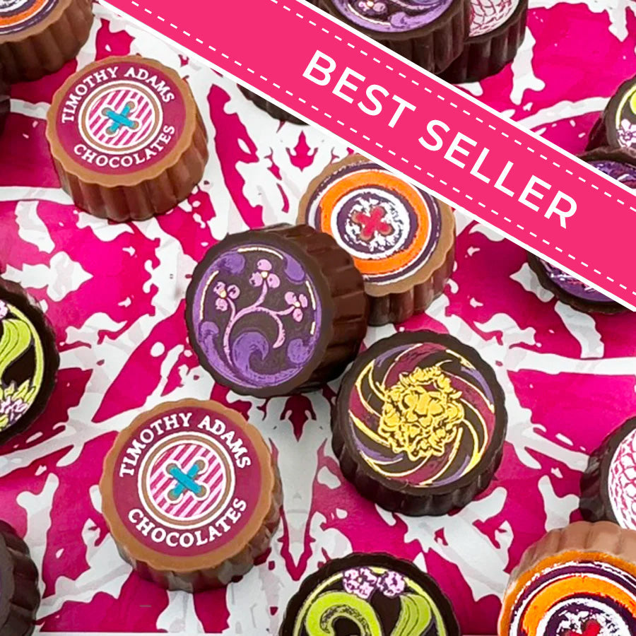 Timothy Adams Ultimate Collection luxury chocolate truffles in couture-inspired box, handcrafted with Valrhona chocolate — bestselling gourmet gift.