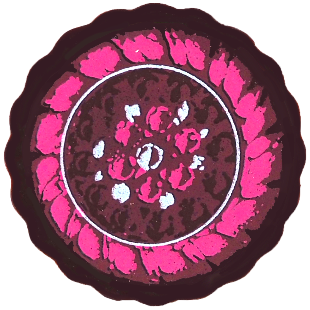 Decorative plate with pink and white floral pattern on a black background. Fresh raspberries simmered in cream and folded into Valrhona dark chocolate ganache, finished in dark couverture. Bright, fruity, and irresistibly indulgent.